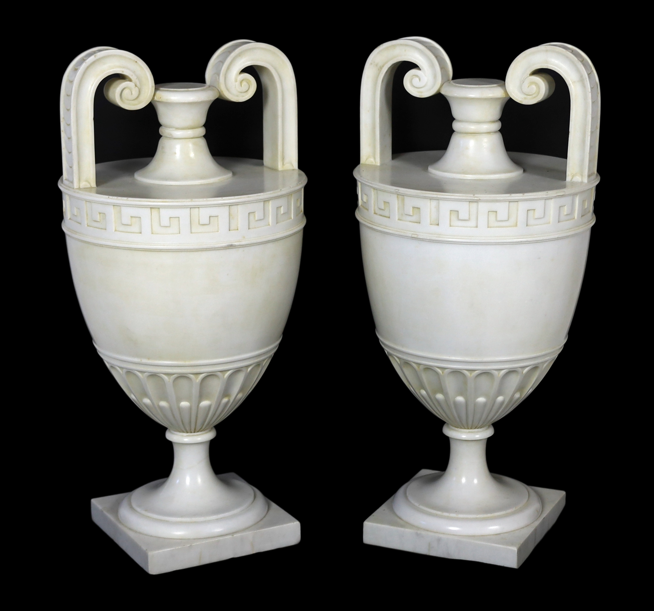 A pair of Italian neo-classical Carrara marble vases, 24cm diameter, 50cm high, Please note this lot attracts an additional import tax of 5% on the hammer price